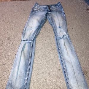 Ripped high waisted skinny jeans.